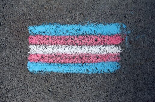 transgender flag drawn on dark surface with chalk